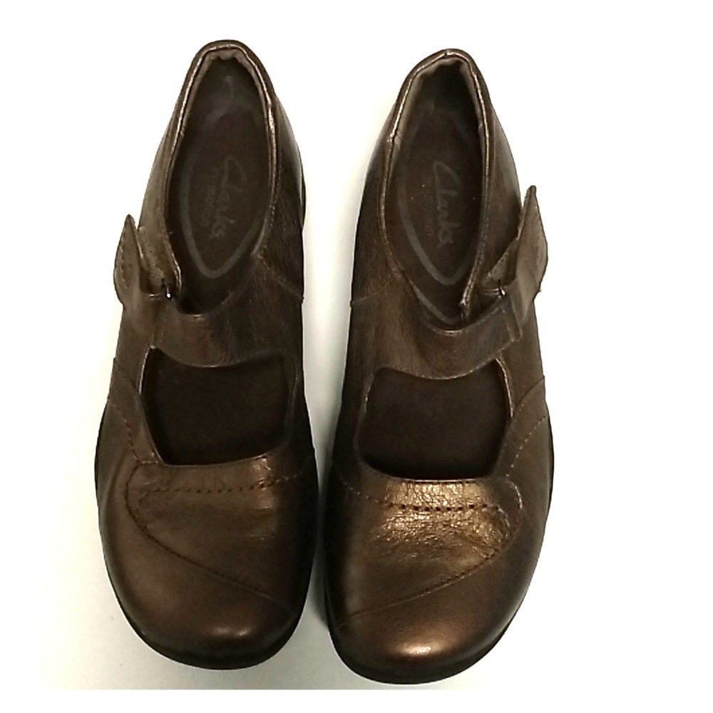 Women Clark's gold slip on very comfortable shoes